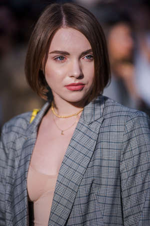 Milan, Italy - September 22, 2017: Woman with a fashionable look, poses for photographers before Versace Fashion Show at Milan Fashion Week - street style concept Spring/Summer 2018.のeditorial素材