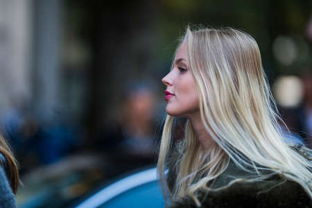 Milan, Italy - September 22, 2017: Fashion model posing outside a fashion show during Milan Fashion Week - street style concept.のeditorial素材