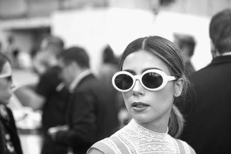 Milan, Italy - September 23, 2017: Fashionable girl posing during Milan Fashion Week - street style...