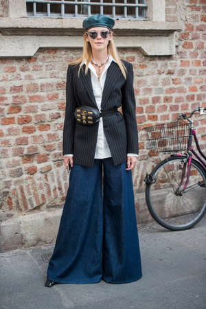 Milan, Italy - September 23, 2017: Fashionable girl posing during Milan Fashion Week - street style fashion concept.のeditorial素材