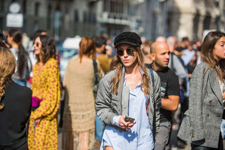 Milan, Italy - September 23, 2017: Fashionable girl posing during Milan Fashion Week - street style fashion concept.のeditorial素材