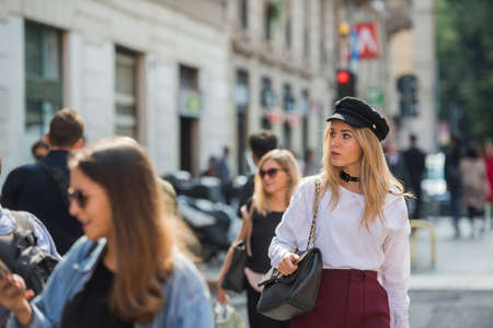 Milan, Italy - September 24, 2017: Fashionable girl posing during Milan Fashion Week - street style fashion concept.のeditorial素材