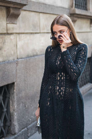 Milan, Italy - September 23, 2017: Beautiful girls outside fashion shows during Milan Fashion Week.のeditorial素材