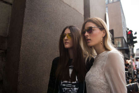Milan, Italy - September 23, 2017: Beautiful girls outside fashion shows during Milan Fashion Week.のeditorial素材