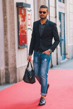 Milan, Italy - September 24, 2017: Men in a fashion outfit posing on the street during Milan Fashion Week.のeditorial素材