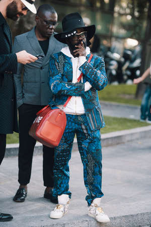 Milan, Italy - September 22, 2017: Street style concept - people with fashionable looks during Milan Fashion Week.のeditorial素材