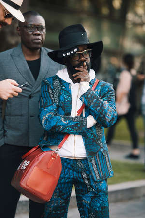 Milan, Italy - September 22, 2017: Street style concept - people with fashionable looks during Milan Fashion Week.のeditorial素材