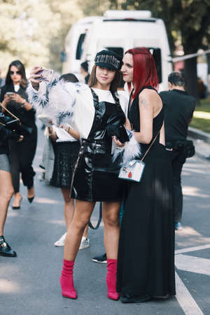 Milan, Italy - September 22, 2018: Fashionable girls on the street during Milan Fashion Week.のeditorial素材