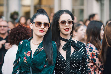 Milan, Italy - September 22, 2018: Fashionable girls on the street during Milan Fashion Week.のeditorial素材