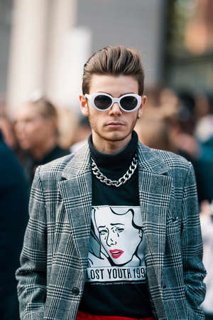 Milan, Italy - September 22, 2017: Fashion mens with elegant looks during Milan Fashion Week.