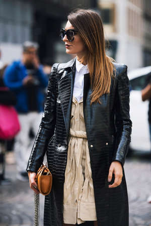 Milan, Italy - September 23, 2017: Fashion girl posing on the street during Milan Fashion Week.のeditorial素材