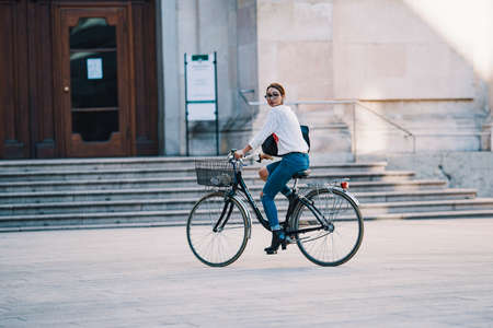 Milan, Italy - September 21, 2018: Beautiful woman on a bike in Milanのeditorial素材