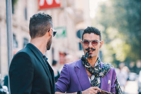 Milan, Italy - September 24, 2017: Fashion mens with elegant looks during Milan Fashion Week.
