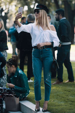 Milan, Italy - September 22, 2018: Woman with a fashionable appearance on the street during Milan Fashion Week.のeditorial素材