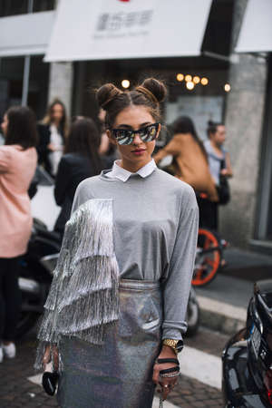 Milan, Italy - September 23, 2017: Fashion girl posing on the street during Milan Fashion Week.
