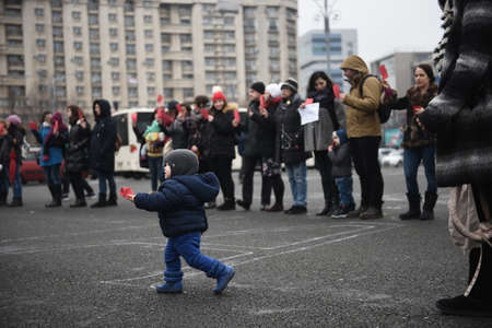 Bucharest, Romania - February 18, 2018: Mothers protest in Victory Square: Dozens of women protested against possible decrease in child rearing allowance.のeditorial素材