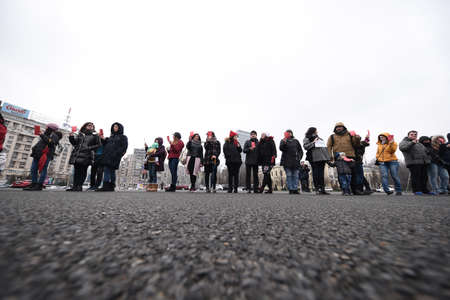 Bucharest, Romania - February 18, 2018: Mothers protest in Victory Square: Dozens of women protested against possible decrease in child rearing allowance.のeditorial素材