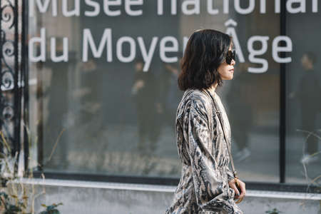 Paris, France - February 27, 2019: Street style outfit -  Fashionable person after a fashion show...