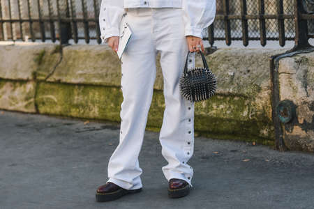 Paris, France - February 27, 2019: Street style outfit  before a fashion show during Paris Fashion...