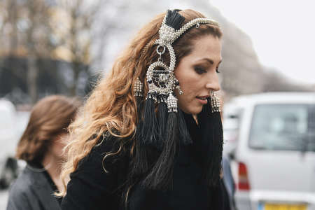 Paris, France - February 28, 2019: Street style outfit before a fashion show during Paris Fashion...
