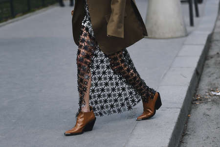 Paris, France - February 28, 2019: Street style outfit -  Sheer skirt, brown blazer, knit before a fashion show during Paris Fashion Week - PFWFW19のeditorial素材