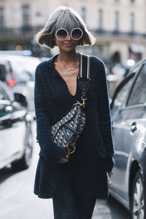 Paris, France - March 04, 2019: Street style outfit -  Fashionable person after a fashion show...