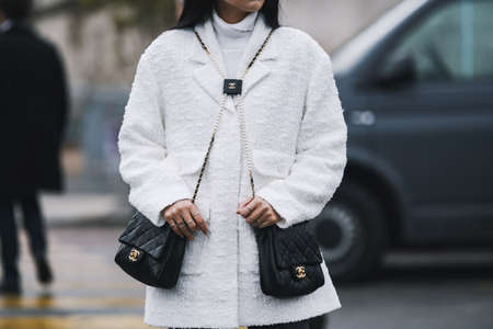 Paris, France - March 05, 2019: Street style outfit -  Chanel bag in detail  after a fashion show...
