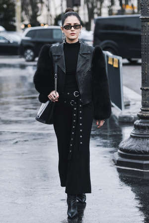 Paris, France - March 5, 2019: Street style - Woman wearing Chanel before a fashion show during...