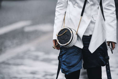 Paris, France - March 05, 2019: Street style outfit -  Woman wearing Chanel purse after a fashion...