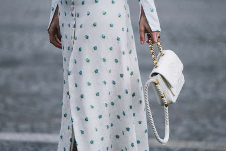 Paris, France - March 05, 2019: Street style outfit -  Woman wearing Chanel purse after a fashion...