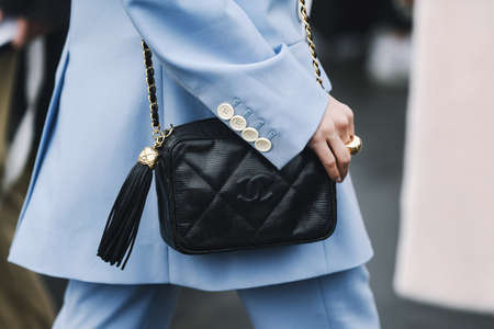 Paris, France - March 05, 2019: Street style outfit -  Woman wearing Chanel purse after a fashion show during Paris Fashion Week - PFWFW19のeditorial素材