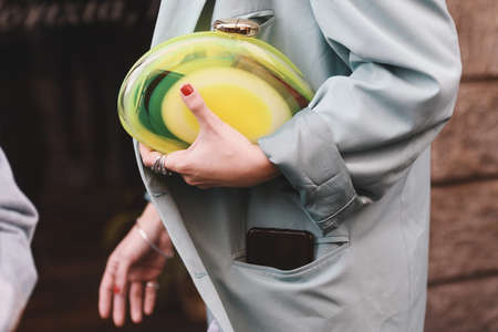 Milan, Italy - February 20, 2019: Purse in detail and street style outfit before a fashion show during Milan Fashion Week  - MFWFW19のeditorial素材