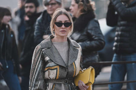 Milan, Italy - February 20, 2019: Street style - woman wearing Gucci after a fashion show during...