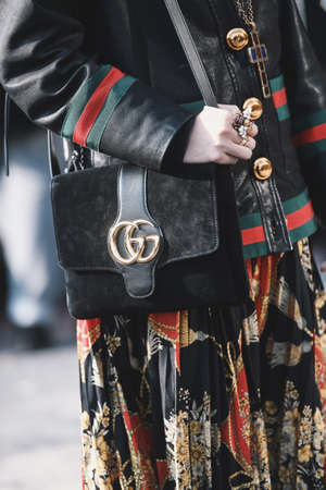 Milan, Italy - February 20, 2019: Street style - woman wearing Gucci after a fashion show during Milan Fashion Week - MFWFW19のeditorial素材
