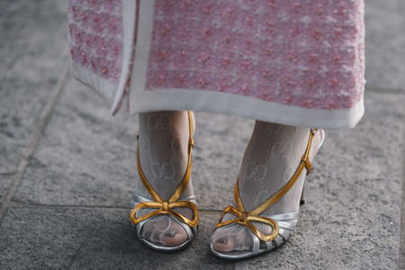 Milan, Italy - February 20, 2019: Girl with a Chanel purse and street style outfit before a fashion show during Milan Fashion Week  - MFWFW19のeditorial素材