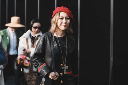 Milan, Italy - February 20, 2019: Street style - woman wearing Gucci after a fashion show during Milan Fashion Week - MFWFW19のeditorial素材