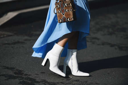 Milan, Italy - February 21, 2019: Street style â€“ Boots detail before a fashion show during...