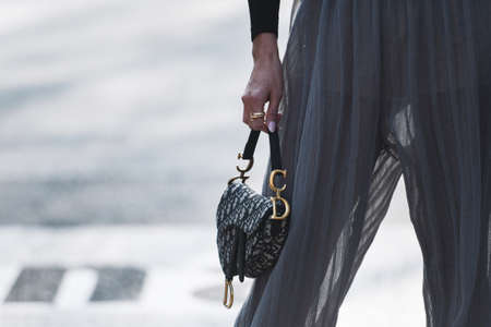 Milan, Italy - February 21, 2019: Street style – Detail of a Dior purse before a fashion show...