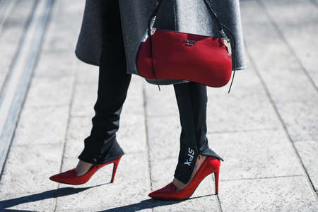 Milan, Italy - February 22, 2019: Street style outfit - Prada purse after a fashion show during...