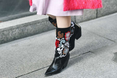 Milan, Italy - February 21, 2019: Street style - Fancy shoes in detail after a fashion show during...