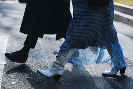 Milan, Italy - February 21, 2019: Street style â Boots detail after a fashion show during Milan Fashion Week - MFWFW19のeditorial素材