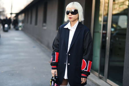 Milan, Italy - February 22, 2019: Street style â€“ Street style outfit in detail during Milan...
