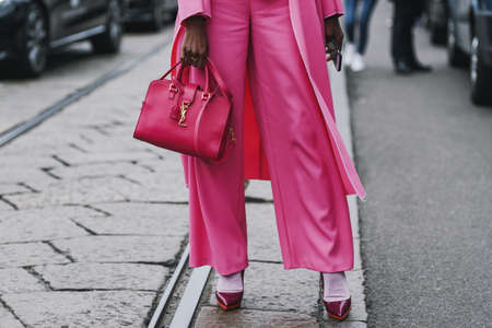 Milan, Italy - February 23, 2019: Street style â€“ YSL purse detail after a fashion show during...