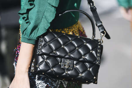 Milan, Italy - February 24, 2019: Street style â€“ Valentino purse detail before a fashion show...