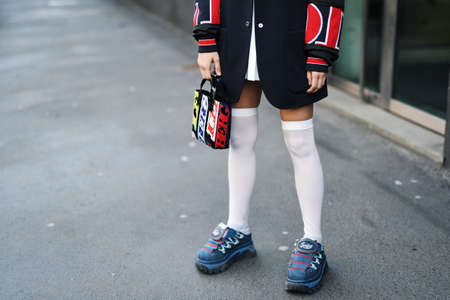 Milan, Italy - February 22, 2019: Street style â Street style outfit in detail during Milan Fashion Week - MFWFW19のeditorial素材