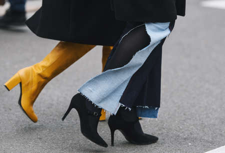 Milan, Italy - February 23, 2019: Street style â Boots detail after a fashion show during Milan Fashion Week - MFWFW19のeditorial素材