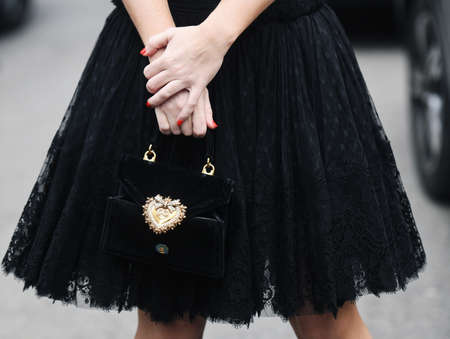 Milan, Italy - February 24, 2019: Street style â€“ Dolce Gabbana purse detail before a fashion...