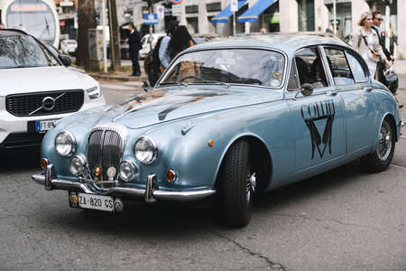 Milan, Italy - February 24, 2019: Street style â€“ Vintage car before a fashion show during...