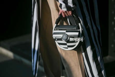 Milan, Italy - February 19, 2020: Street style detail - accesories and clothingstreet style clothing and accesory detail - StreetStyleFW2020のeditorial素材