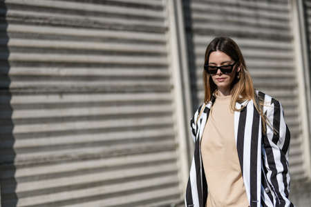 Milan, Italy - February 19, 2020: Street style appearance during Milan Fashion Week - streetstylefw20のeditorial素材